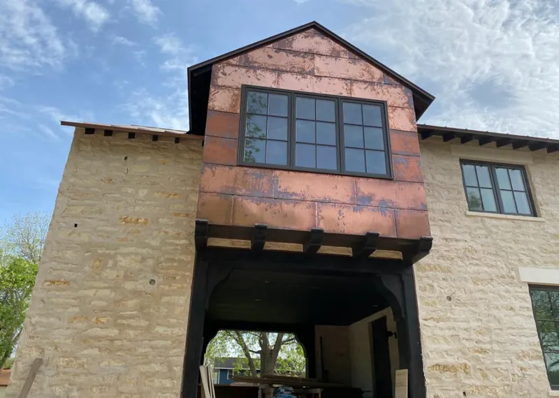 Copper metal panel facade on a stone building for Metal Roof Coating in Valley Center